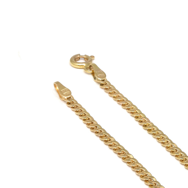 Tobillera eslabón barbado en oro amarillo 14 kilates.