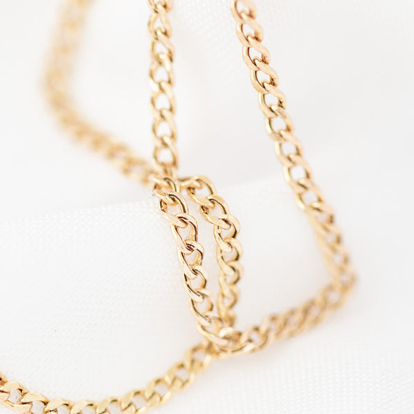Collar eslabón barbado en oro amarillo 14 kilates.