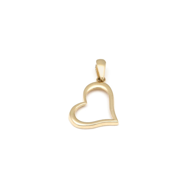 Dije diseño especial motivo corazón en oro amarillo 14 kilates.