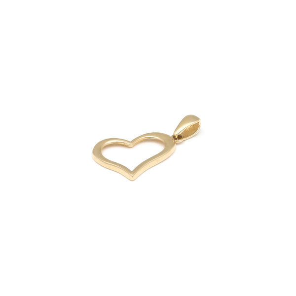 Dije diseño especial motivo corazón en oro amarillo 14 kilates.