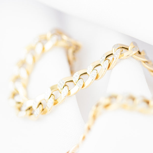 Pulsera eslabón barbado platinado en oro amarillo 14 kilates.