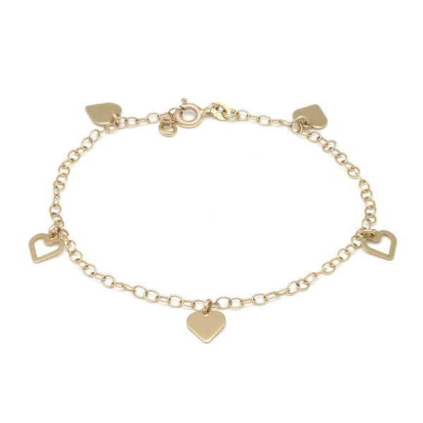 Pulsera eslabón cruzado con colgantes motivo corazón en oro amarillo 14 kilates.