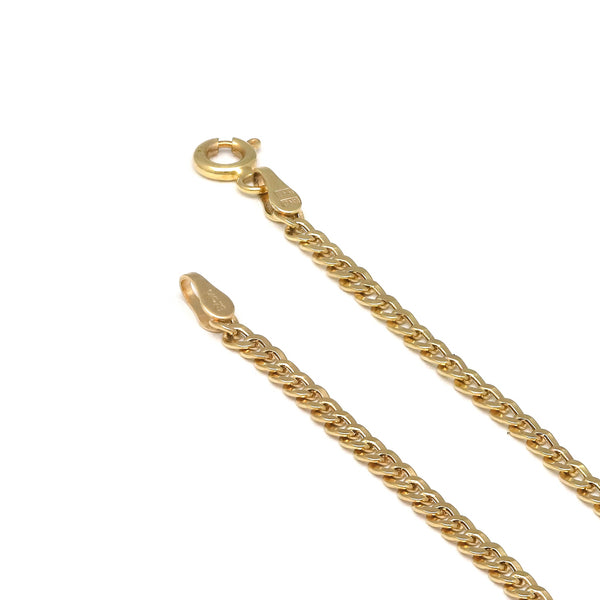 Tobillera eslabón barbado en oro amarillo 14 kilates.