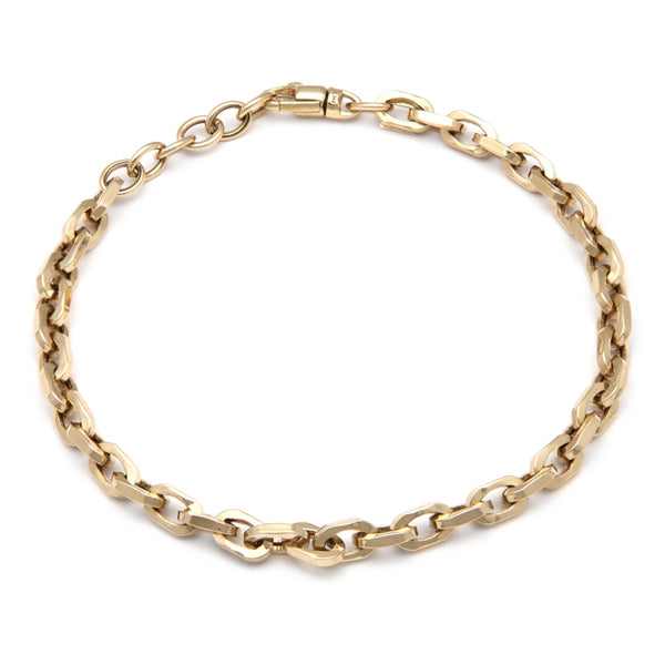 Pulsera eslabón cruzado en oro amarillo 14 kilates.