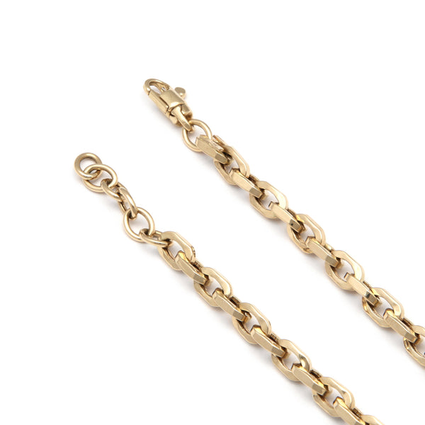 Pulsera eslabón cruzado en oro amarillo 14 kilates.