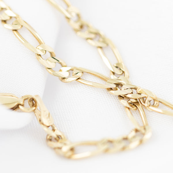 Pulsera de tres eslabones por uno en oro amarillo 14 kilates.