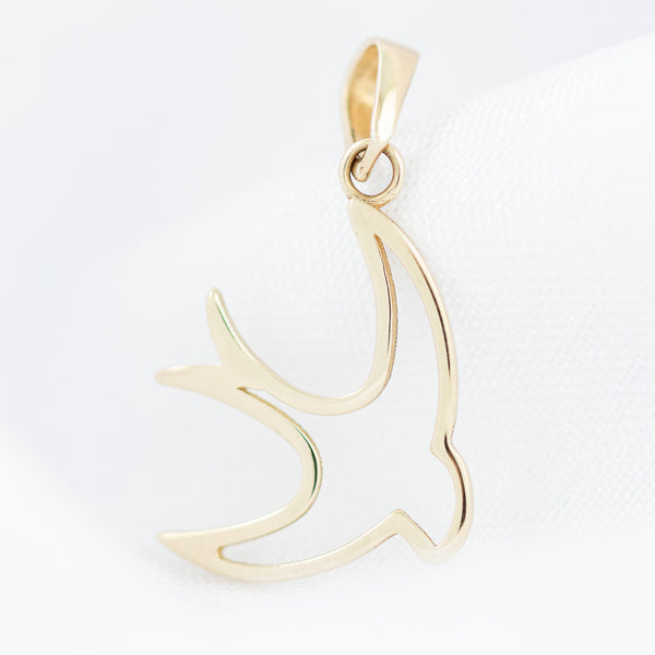 Dije diseño especial motivo ave en oro amarillo 14 kilates.