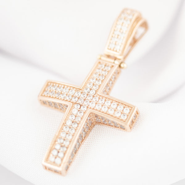 Cruz diseño especial con circonias en oro rosa 14 kilates.