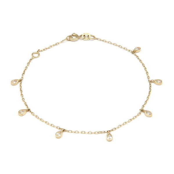 Pulsera eslabón cruzado con colgantes motivo gotas y circonias en oro amarillo 14 kilates.