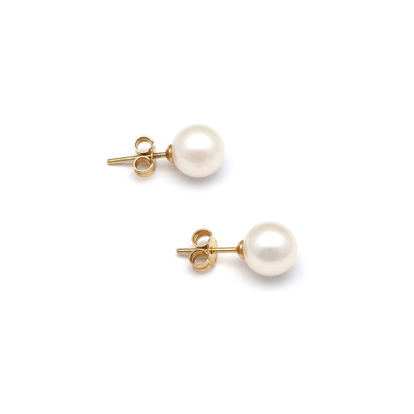 Aretes diseño especial con perlas en oro amarillo 14 kilates.