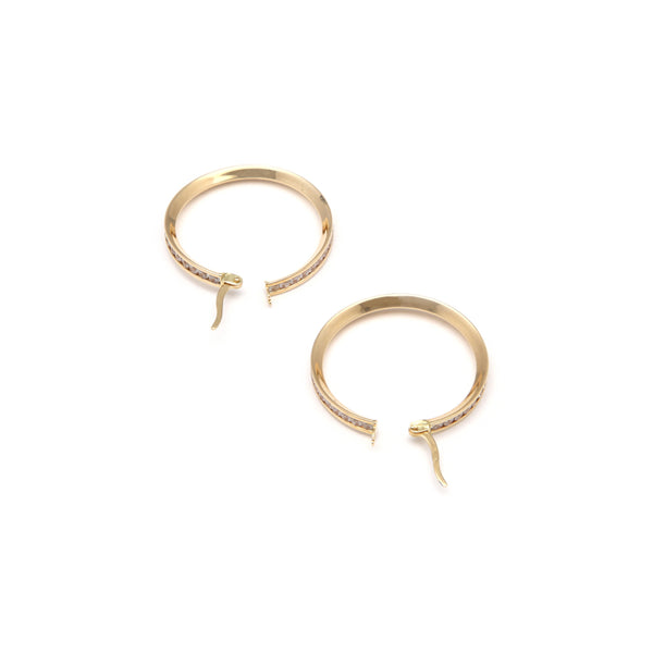 Arracadas diseño especial con circonias en oro amarillo 14 kilates.