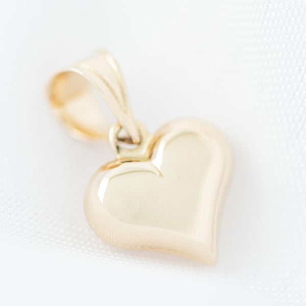Dije hueco motivo corazón oro amarillo 14 kilates