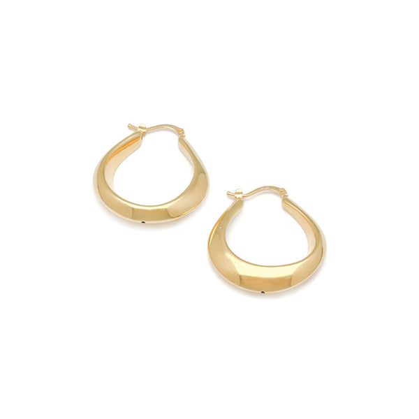 Arracadas lisas huecas en oro amarillo 14 kilates.