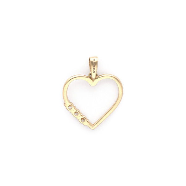 Dije calado motivo corazón con circonias en oro amarillo 14 kilates.