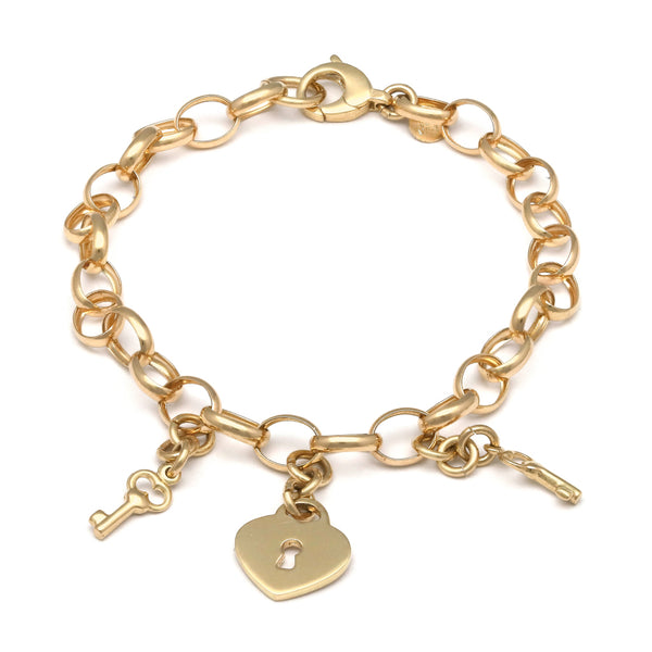 Pulsera eslabón cruzado con colgantes motivo llaves y candado en oro amarillo 14 kilates.