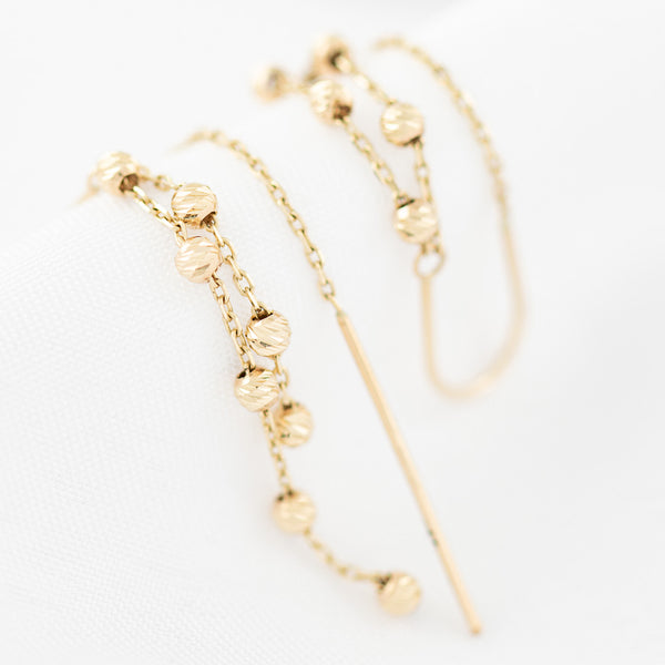 Aretes diseño especial con colgantes en oro amarillo 14 kilates.