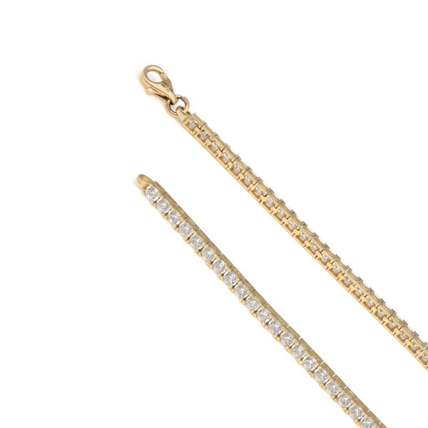 Pulsera eslabón articulado con circonias en oro amarillo 14 kilates.