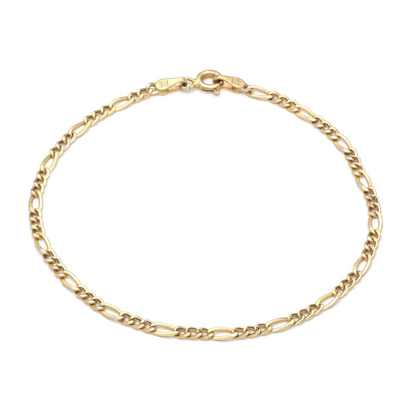 Pulsera de tres eslabones por uno en oro amarillo 14 kilates.