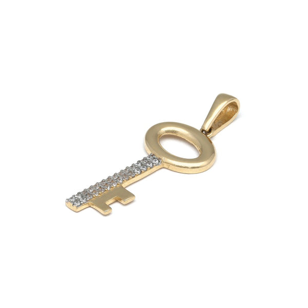 Dije diseño especial motivo llave con circonias en oro amarillo 14 kilates.