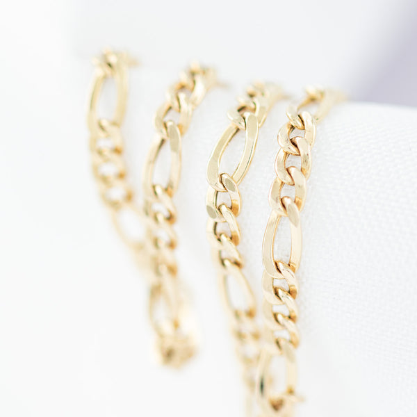 Pulsera de tres eslabones por uno en oro amarillo 14 kilates.