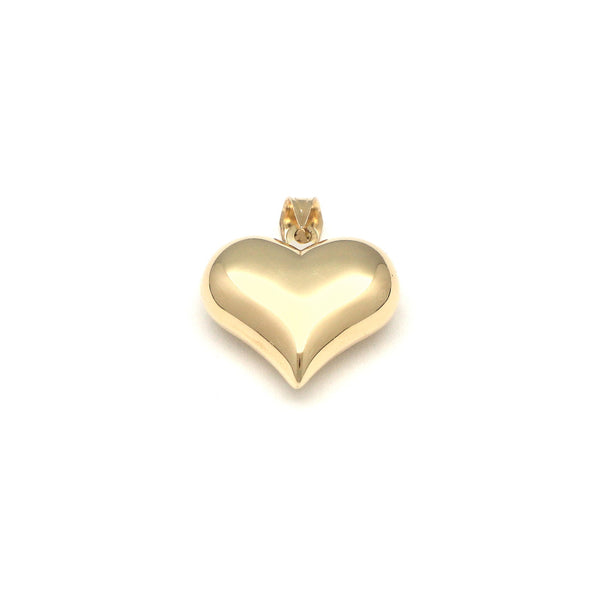 Dije hueco motivo corazón en oro amarillo 14 kilates.