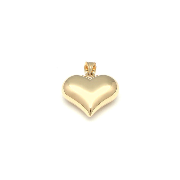 Dije hueco motivo corazón en oro amarillo 14 kilates.