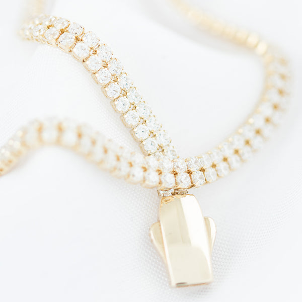 Pulsera eslabón articulado con circonias en oro amarillo 14 kilates.