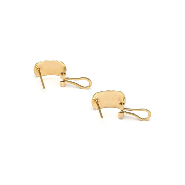 Aretes diseño especial en oro amarillo 14 kilates.