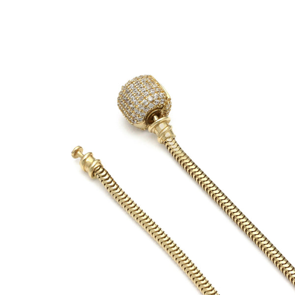 Pulsera eslabón articulado con aplicación y colgantes motivo figuras diferentes con sintéticos y esmalte en oro amarillo 14 kilates.