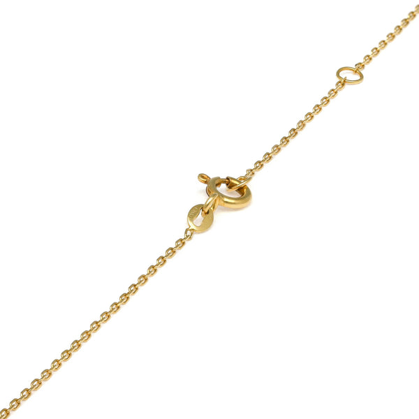 Collar eslabón Cruzado con aplicación y colgante en oro amarillo 14 kilates.