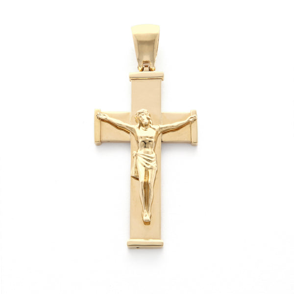 Crucifijo liso en oro amarillo 14 kilates.
