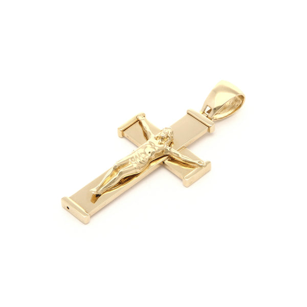 Crucifijo liso en oro amarillo 14 kilates.