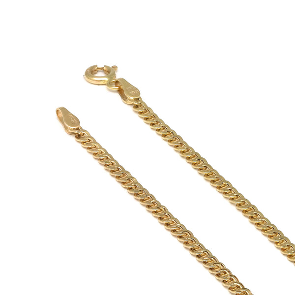 Tobillera eslabón barbado en oro amarillo 14 kilates.