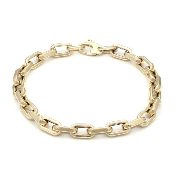 Pulsera eslabón cruzado en oro amarillo 14 kilates.