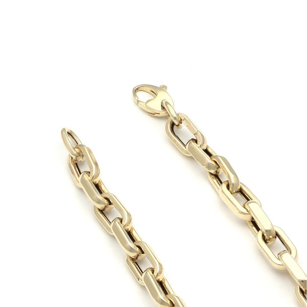 Pulsera eslabón cruzado en oro amarillo 14 kilates.
