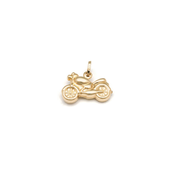 Dije hueco motivo motocicleta en oro amarillo 14 kilates.