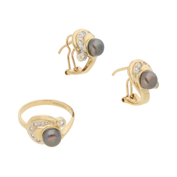 Juego anillo y aretes diseño especial con perlas y sintéticos en oro amarillo 14 kilates.