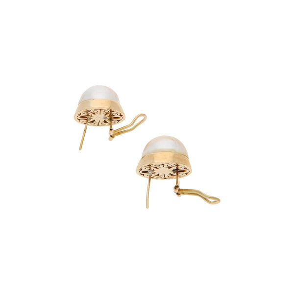 Juego de anillo y aretes diseño especial con medias perlas en oro amarillo 12 kilates.
