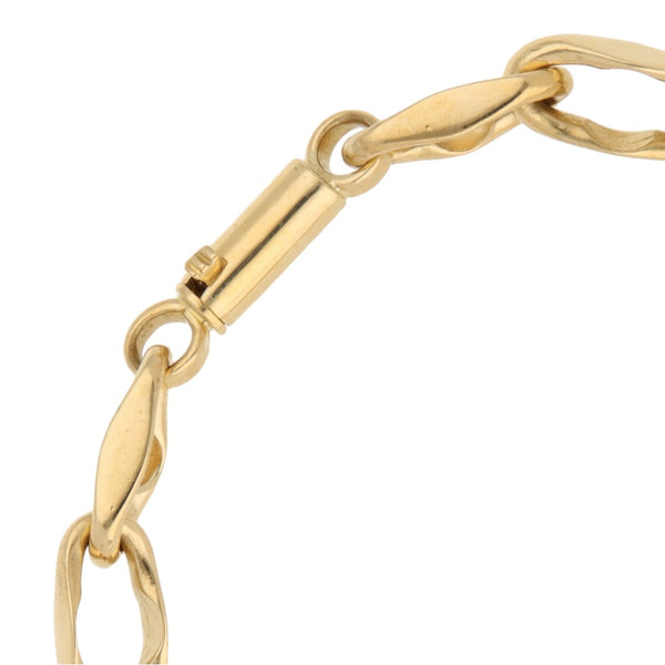 Pulsera eslabón cruzado en oro amarillo 18 kilates.