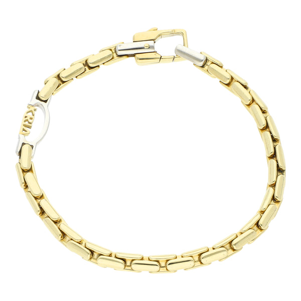 Pulsera eslabón articulado firma Kria en oro dos tonos 18 kilates.