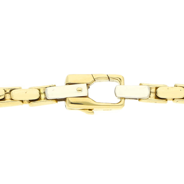 Pulsera eslabón articulado firma Kria en oro dos tonos 18 kilates.