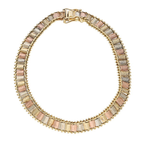 Pulsera eslabón boleado en oro tres tonos 14 kilates.