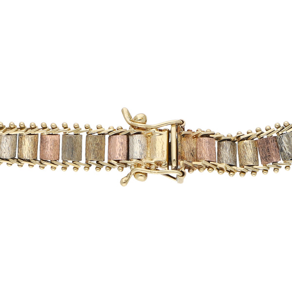 Pulsera eslabón boleado en oro tres tonos 14 kilates.