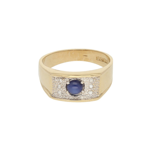 Anillo diseño especial con zafiro estrella y circonias en oro amarillo 14 kilates.