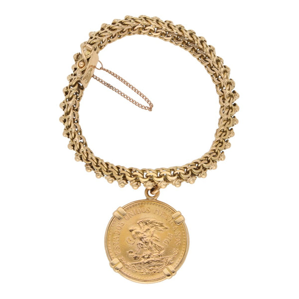 Pulsera eslabón tejido con aplicaciones y colgante con una moneda de veinte pesos oro mexicano 21.6 kilates en oro amarillo 18 kilates.