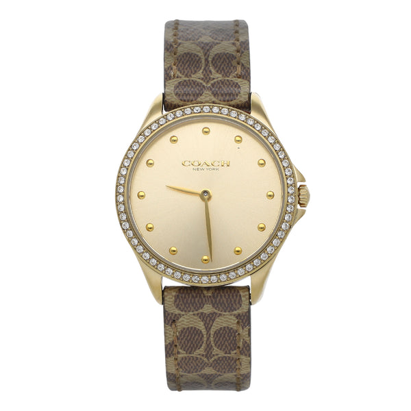 Reloj Coach para dama en acero chapa correa piel.