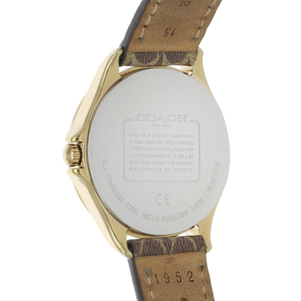 Reloj Coach para dama en acero chapa correa piel.