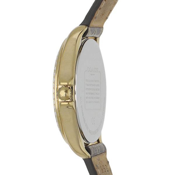 Reloj Coach para dama en acero chapa correa piel.