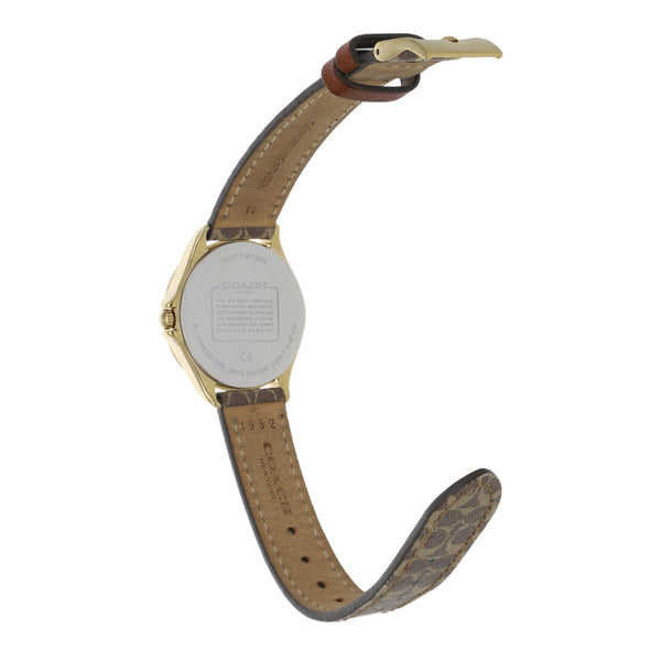 Reloj Coach para dama en acero chapa correa piel.