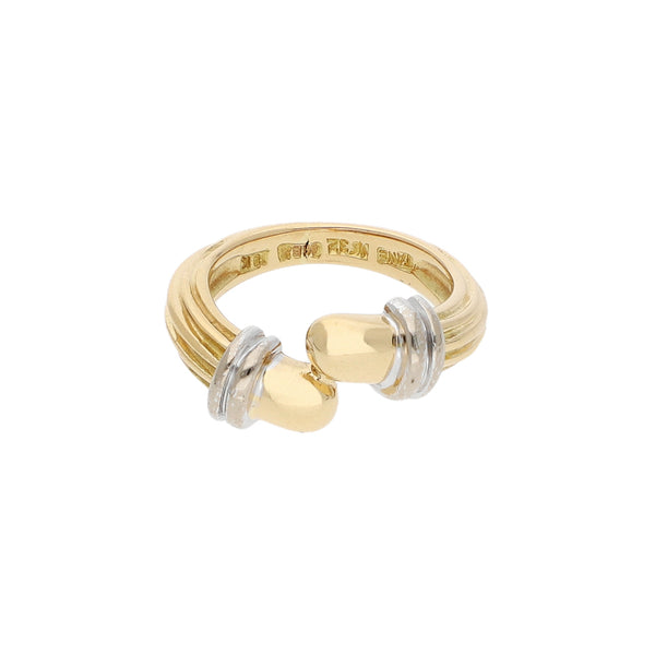 Anillo estilizado firma Tane en oro dos tonos 18 kilates.